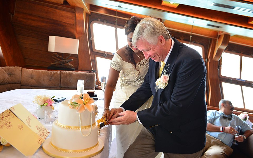 bride and groom cutting cake royal albatross