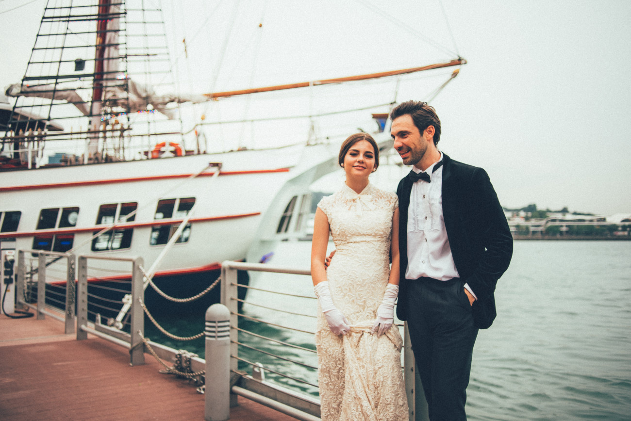 groom and bride on dock royal albatross