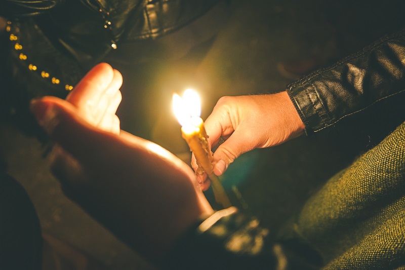 man holding a candle royal albatross