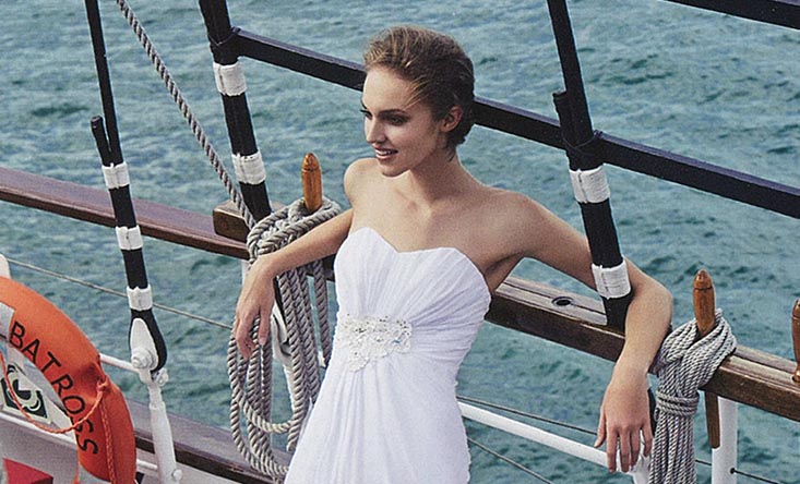 bride leaning on the ship deck royal albatross