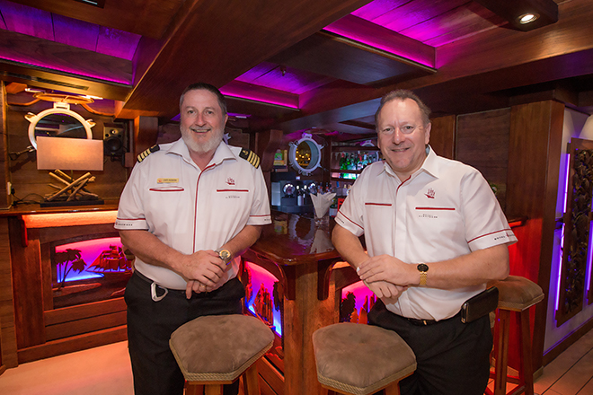 captain duncan and pete pele in grand salon on royal albatross