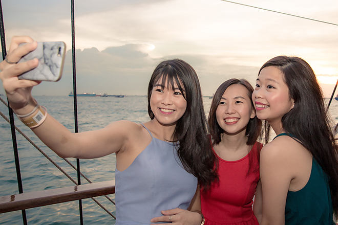 girl friends taking selfie in royal albatross