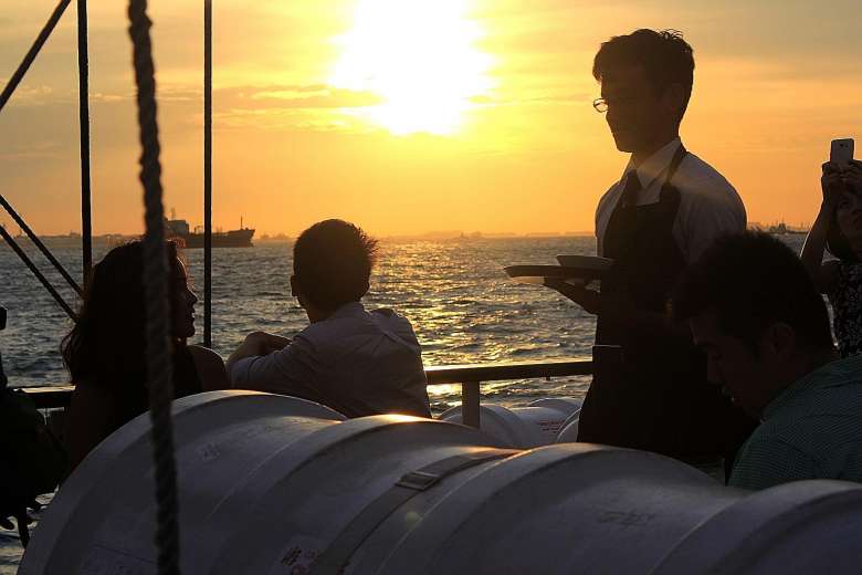 guest being served on sunset sail royal albatross