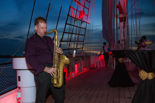 live saxophone playing jazz on sunset sail royal albatross