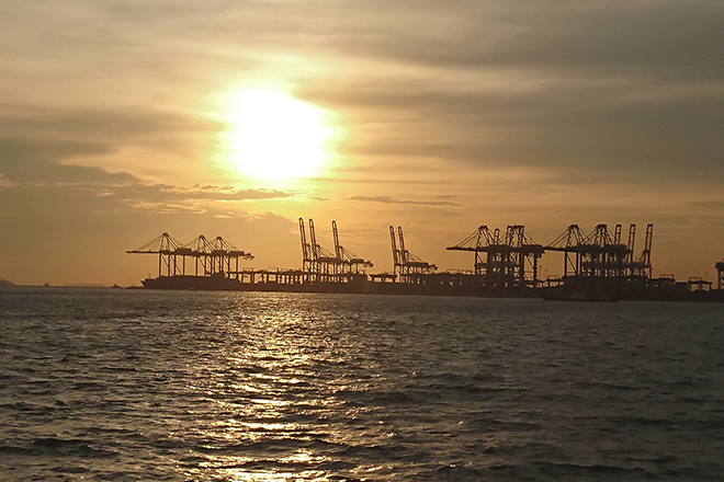 sunset with port silhouette in singapore royal albatross